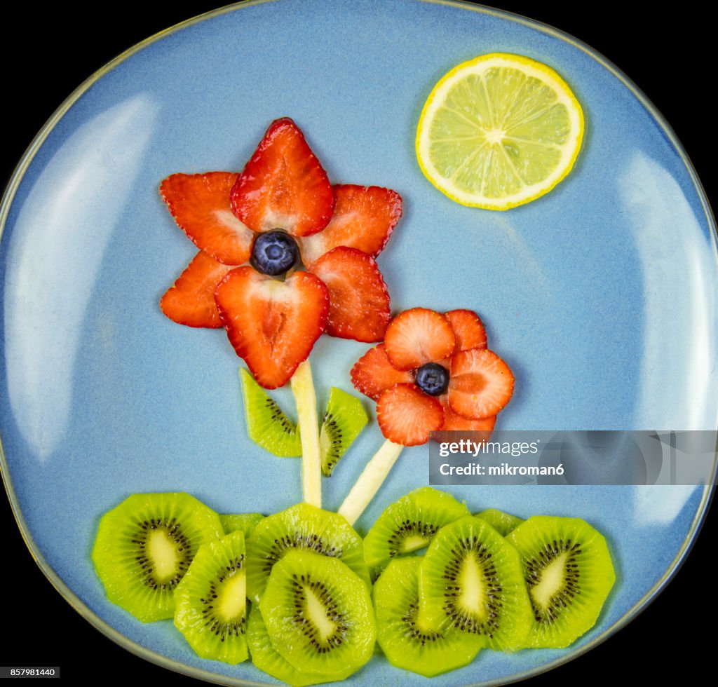 Flowers made with fresh fruits. Fruit Art Recipe. Food art creative concepts.