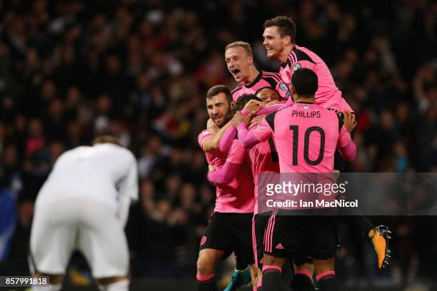 Scotland players celebrate as Martin Skrtel of Slovakia scores an own goal for their first goal during the FIFA 2018 World Cup Group F Qualifier...