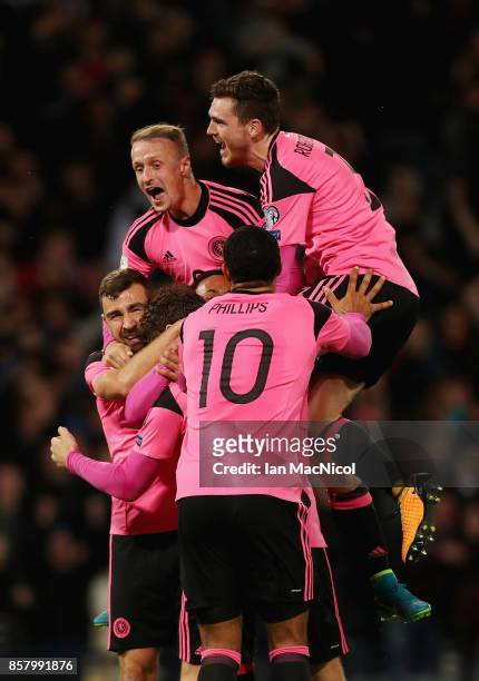 Scotland players celebrate as Martin Skrtel of Slovakia scores an own goal for their first goal during the FIFA 2018 World Cup Group F Qualifier...