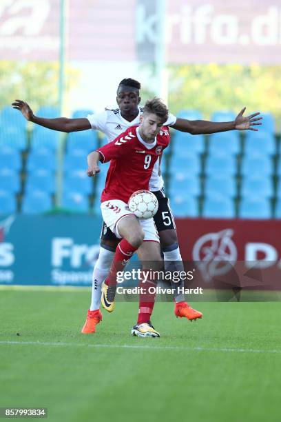 Kevin Vangu Phambu Bukusu of Germany and Muamer Brajanac of Denmark compete for the ball during the Mens U17 international friendly match between...