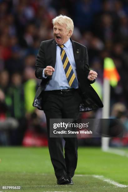 Gordon Strachan manager of Scotland celebrates as Martin Skrtel of Slovakia scores an own goal for their first goal during the FIFA 2018 World Cup...