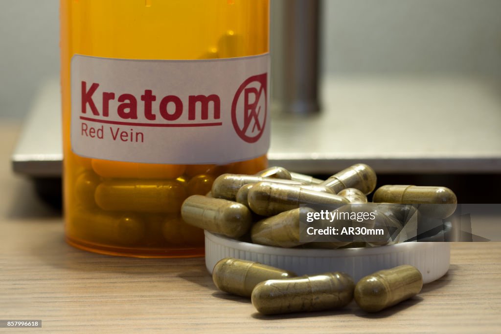 Kratom pills on a desk