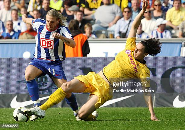 Andrey Voronin of Berlin battles for the ball with Neven Subotic of Dortmund during the Bundesliga match between Hertha BSC Berlin and Borussia...