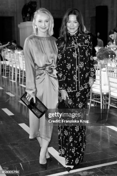 German actresses Anna Maria Muehe and Hannah Herzsprung in Erdem x H&M attend the Florale By Triumph Dinner Hosted By Julianne Moore at Altes...