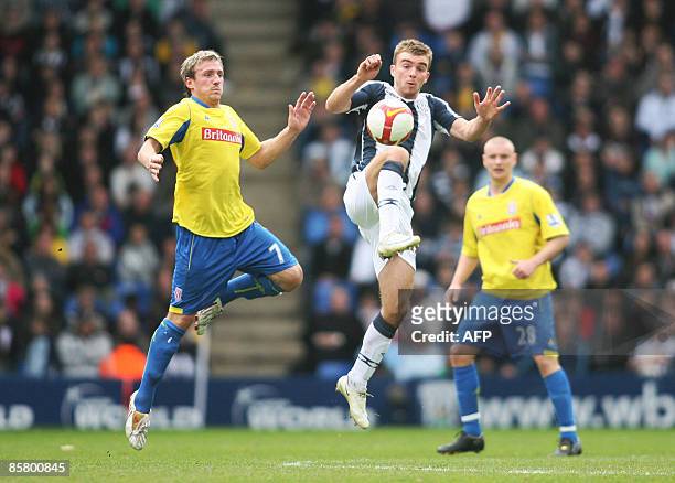 West Bromwich Albion's James Morrison fights for the ball with Stoke City's Liam Lawrence during their Premier League football match at The Hawthorns...