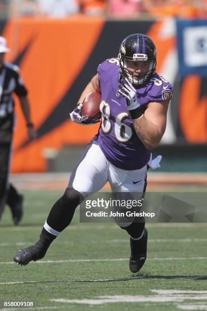 Nick Boyle of the Baltimore Ravens runs the football upfield during the game against the Cincinnati Bengals at Paul Brown Stadium on September 10,...