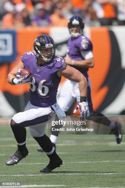 Nick Boyle of the Baltimore Ravens runs the football upfield during the game against the Cincinnati Bengals at Paul Brown Stadium on September 10,...