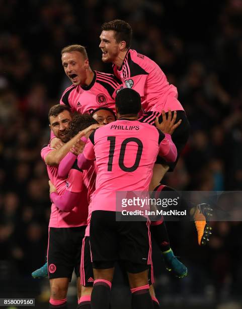 Scotland players celebrates after Martin Skrtel of Slovakia scores in his own net during the FIFA 2018 World Cup Qualifier between Scotland and...