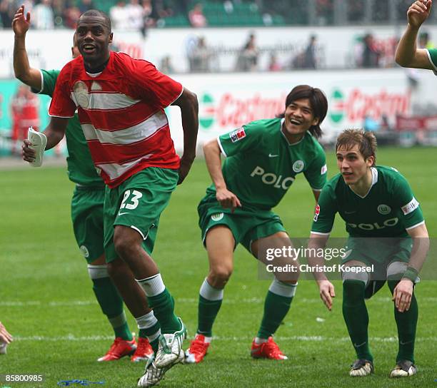 Grafite, Yoshito Okubo and Alexander Esswein of Wolfsburg celebrate their victory after the Bundesliga match between VfL Wolfsburg and FC Bayern...