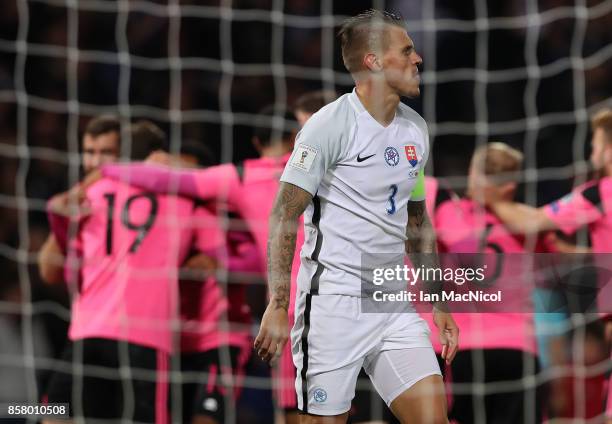 Scotland players celebrates after Martin Skrtel of Slovakia scores in his own net during the FIFA 2018 World Cup Qualifier between Scotland and...