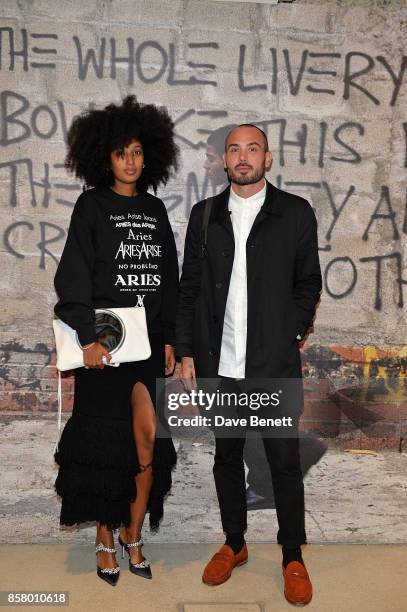 Julia Sarr-Jamois and guest attend a private view of the Basquiat exhibition co-hosted by NET-A-PORTER in partnership with Frieze at Barbican Centre...