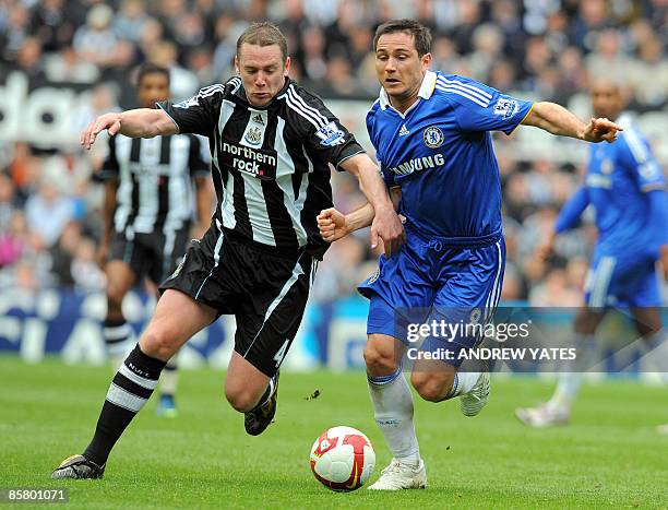 Chelsea's English midfielder Frank Lampard fights for the ball with Newcastle United's English midfielder Kevin Nolan during their English Premier...