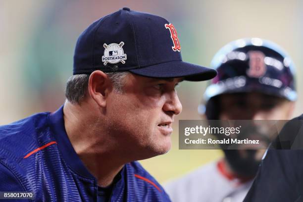 Manager John Farrell of the Boston Red Sox reacts during game one of the American League Division Series between the Boston Red Sox and the Houston...