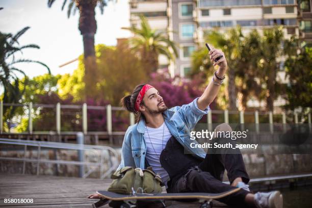 skater man making selfie - park man made space stock pictures, royalty-free photos & images