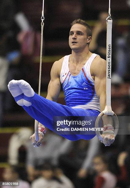 France's Benoit Caranobe performs on rings during the All-Around final of the Third European Men's Artistic Championships on April 4, 2009 in Assago,...