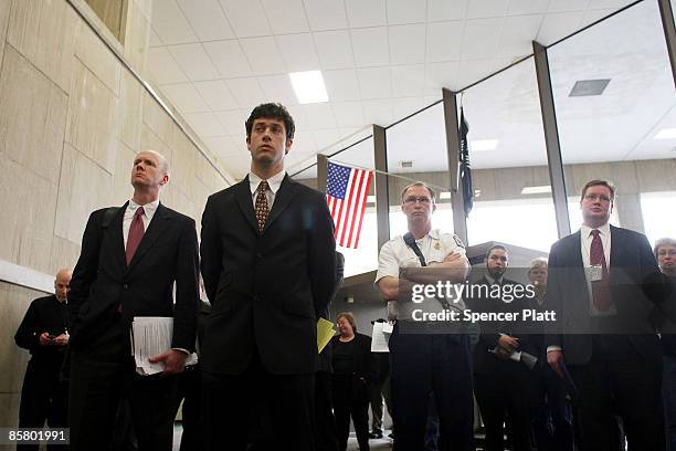 Public officals attend a news conference a day after a shooting where a gunman killed 13 people in an immigration community center April 4, 2009 in...