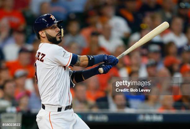 Marwin Gonzalez of the Houston Astros hits a two-run RBI double in the fourth inning against the Boston Red Sox during game one of the American...