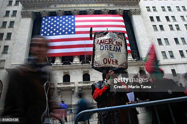 People demonstrate outside the New York Stock Exchange April 4, 2009 in New York City. Hundreds of anti-capitalist and anti-war protesters gathered...