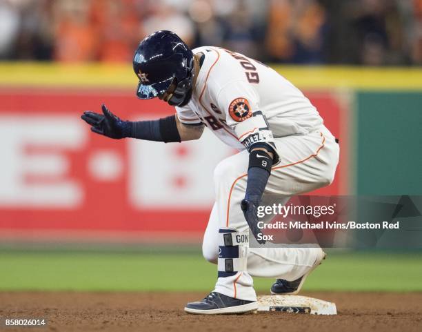 Marwin Gonzalez of the Houston Astros reacts after hitting a two-run double against the Boston Red Sox in the fourth inning of game one of the...