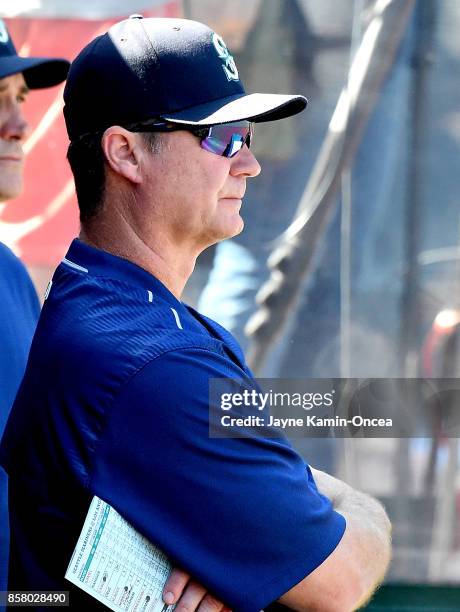 Manager Scott Servais of the Seattle Mariners stands in the dugout during the seventh inning of the game against the Los Angeles Angels of Anaheim at...