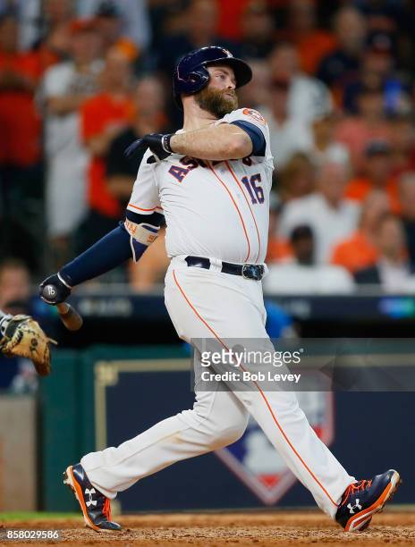 Brian McCann of the Houston Astros hits a two-run RBI single in the sixth inning against the Boston Red Sox during game one of the American League...