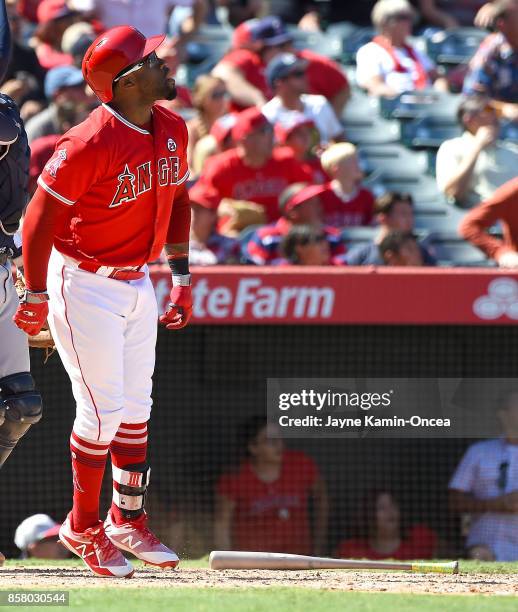 Eric Young Jr. #8 of the Los Angeles Angels of Anaheim watches his ball clear the fence a three run home run in the seventh inning of the game...