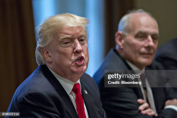 President Donald Trump speaks as John Kelly, White House chief of staff, right, listens during a briefing with senior military leaders in the Cabinet...