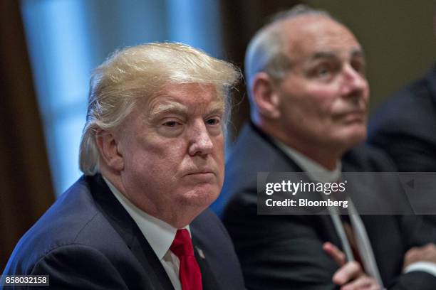 President Donald Trump, left, pauses after speaking during a briefing with senior military leaders in the Cabinet Room of the White House in...
