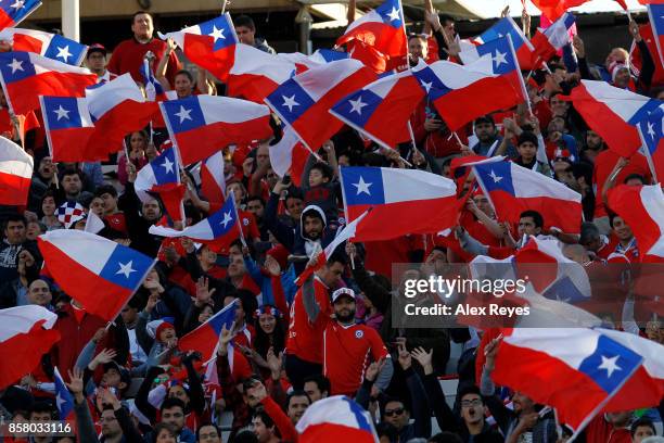 Fans of Chile cheer for their team prior to a match between Chile and Ecuador as part of FIFA 2018 World Cup Qualifiers at Monumental Stadium on...