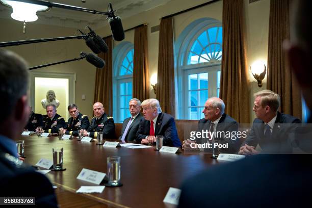 President Donald Trump , national security advisor H.R. McMaster , White House chief of staff John Kelly and Defense Secretary Jim Mattis attend a...