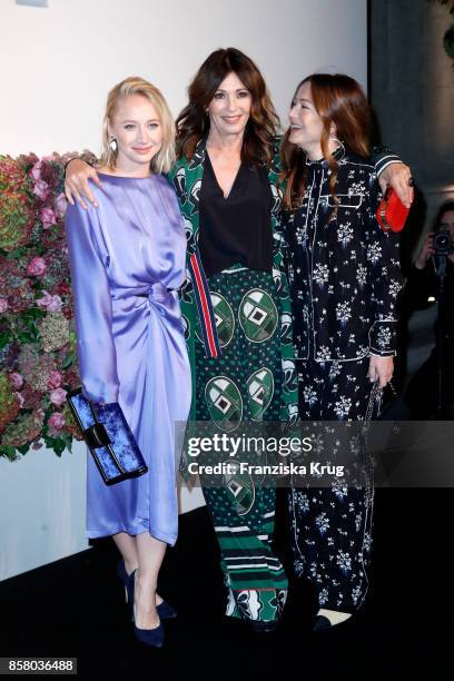 German actresses Anna Maria Muehe, Iris Berben and Hannah Herzsprung in in Erdem x H&M attend the Florale By Triumph Dinner Hosted By Julianne Moore...