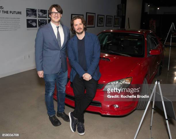 Director Edgar Wright and LA Times reporter Mark Olsen pose with a Subaru car at the 'Cars, Arts & Beats: A Night Out With 'Baby Driver'" event at...