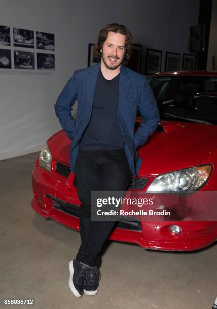 Director Edgar Wright poses with a Subaru car at the 'Cars, Arts & Beats: A Night Out With 'Baby Driver'" event at the Petersen Automotive Museum on...