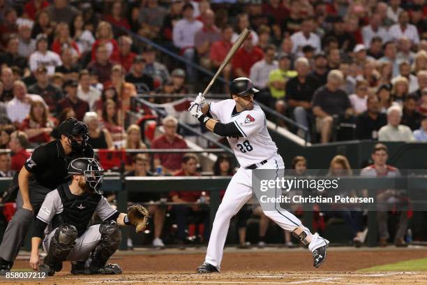 Martinez of the Arizona Diamondbacks bats against the Colorado Rockies during the first inning of the National League Wild Card game at Chase Field...