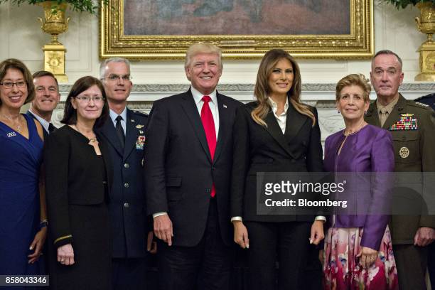 President Donald Trump, center left, and U.S. First Lady Melania Trump, center right, stand for an official photograph with senior military leaders...