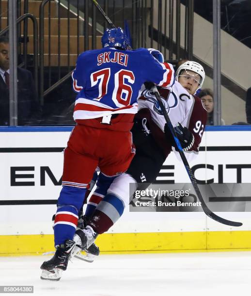 Brady Skjei of the New York Rangers steps into Gabriel Landeskog of the Colorado Avalanche during the first period at Madison Square Garden on...