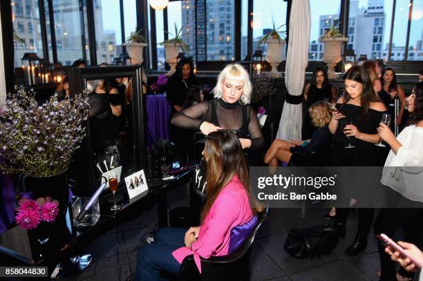 Guests get their hair styled at the launch of ghd hair North America Nocturne Holiday Campaign with Olivia Culpo & Justine Marjan on October 5, 2017...