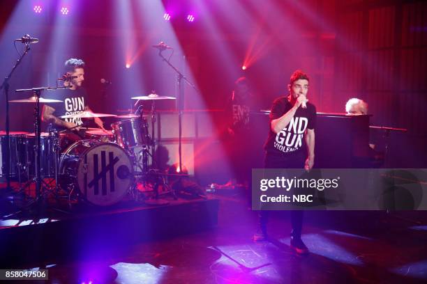 Episode 590 -- Pictured: Musical guests David Boyd, Louis Vecchio, Søren Hansen of New Politics perform on October 5, 2017 --