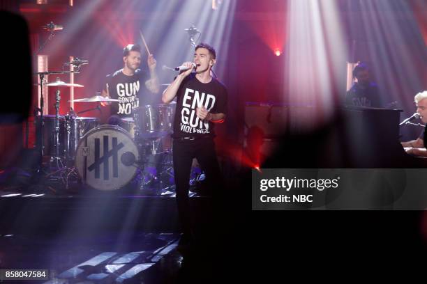 Episode 590 -- Pictured: Musical guests David Boyd, Louis Vecchio, Søren Hansen of New Politics perform on October 5, 2017 --