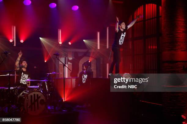 Episode 590 -- Pictured: Musical guests David Boyd, Louis Vecchio, Søren Hansen of New Politics perform on October 5, 2017 --