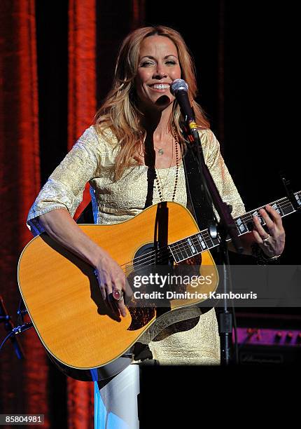 Musician Sheryl Crow performs onstage at the David Lynch Foundation "Change Begins Within" show at Radio City Music Hall on April 4, 2009 in New York...