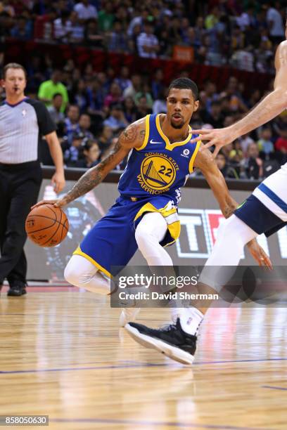 Michael Gbinije of the Golden State Warriors dribbles the ball against the Minnesota Timberwolves as part of 2017 NBA Global Games China on October...
