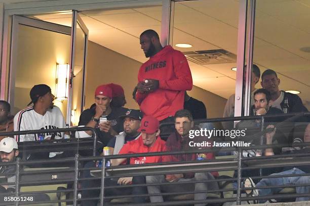 LeBron James of the Cleveland Cavaliers watches game one of the American League Division Series between the Cleveland Indians and the New York...