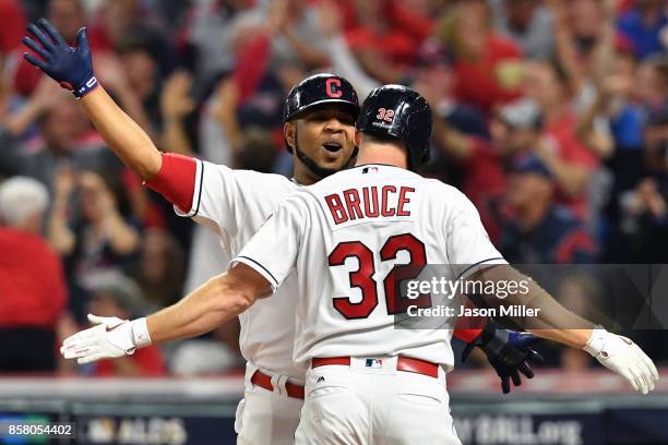 Jay Bruce is congratulated by his teammate Edwin Encarnacion of the Cleveland Indians after hitting a two-run home run during the fourth inning...