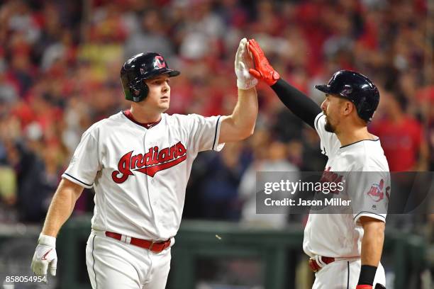 Jay Bruce is congratulated by his teammate Lonnie Chisenhall of the Cleveland Indians after hitting a two-run home run during the fourth inning...