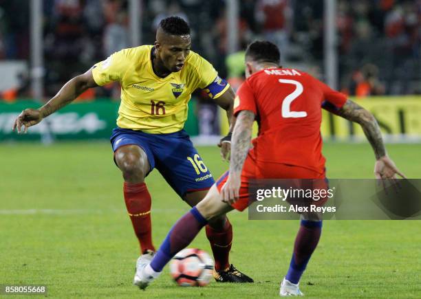 Antonio Valencia of Ecuador fights for the ball with Eugenio Mena of Chile during a match between Chile and Ecuador as part of FIFA 2018 World Cup...
