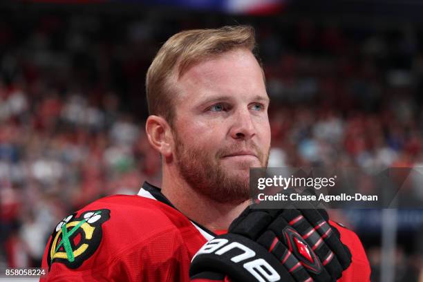 Bryan Bickell of the Chicago Blackhawks stands for the national anthem prior to the game against the Pittsburgh Penguins at the United Center on...