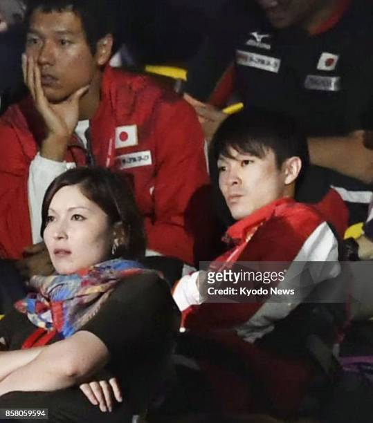 Olympic gymnastics champion Kohei Uchimura of Japan watches from the stands the men's all-around final at the world championships in Montreal,...