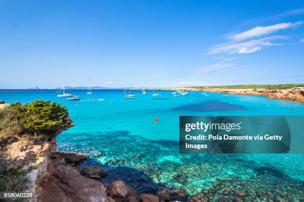 cala saona, formentera coastline idyllic beach in balearic islands, spain - formentera foto e immagini stock