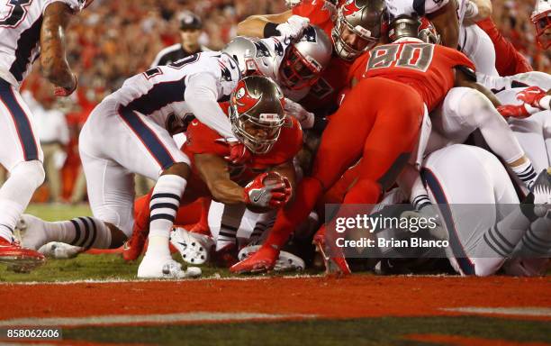 Running back Doug Martin of the Tampa Bay Buccaneers gets into the end zone on a one-yard rush for a touchdown during the second quarter of an NFL...